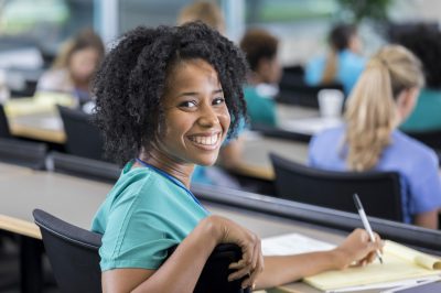 Female medical student turns to smile for camera